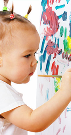 Young child Painting on a Wall